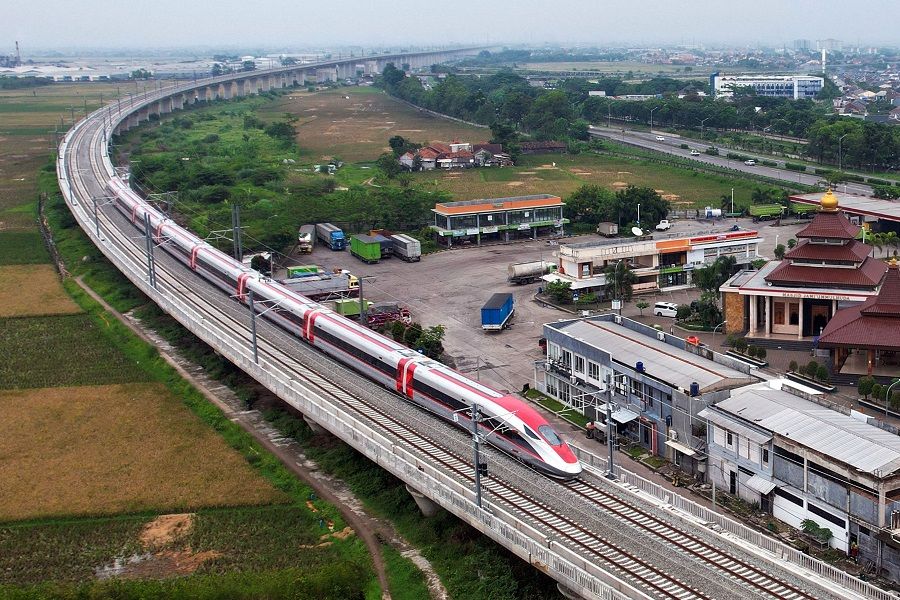 This aerial view shows a high-speed train built in cooperation between Indonesia and China moving along its dedicated track, prior to a dynamic test, in Tegalluar, Indonesia, on 9 November 2022. (Timur Matahari/AFP)