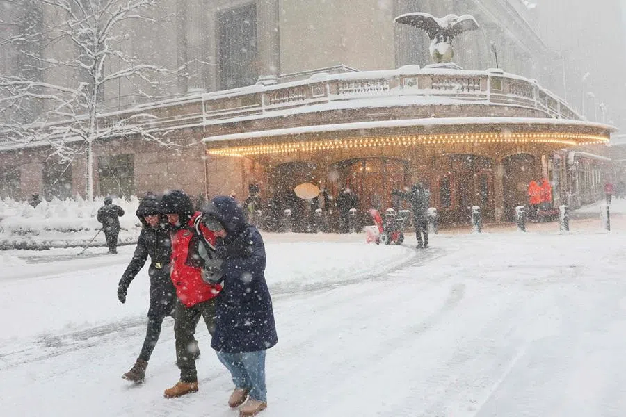 People walk along 42nd Street near Grand Central Station during a blizzard on 23 February 2026, in New York City. (Michael M. Santiago/Getty Images/AFP)