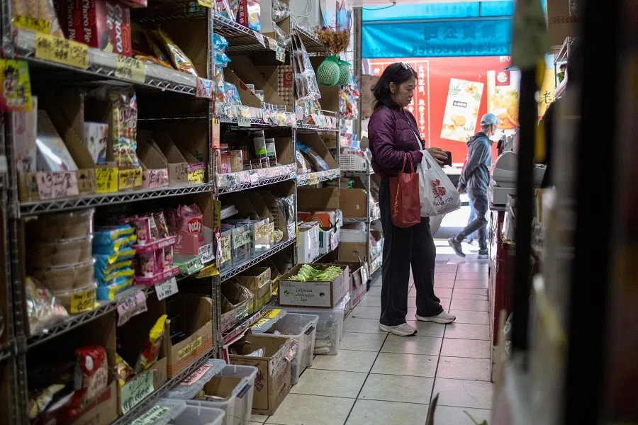 A woman shops at a commercial area of San Francisco’s Chinatown as trade tensions escalate over US tariffs with China, in California, US, on 14 April 2025. (Carlos Barria/Reuters)