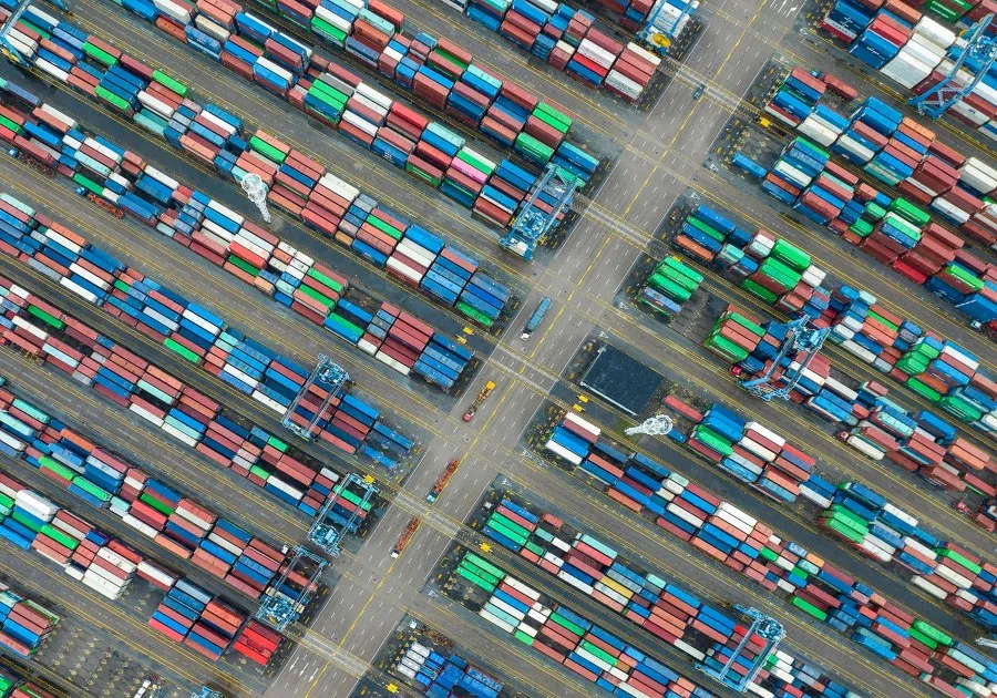 This aerial photo taken on 19 April 2023 shows shipping containers stacked at Zhoushan port in Ningbo, in China's eastern Zhejiang province. (AFP)