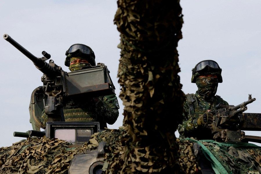 Taiwan's armed forces hold two days of routine drills to show combat readiness ahead of Lunar New Year holidays at a military base in Kaohsiung, Taiwan, 11 January 2023. (Ann Wang/Reuters)