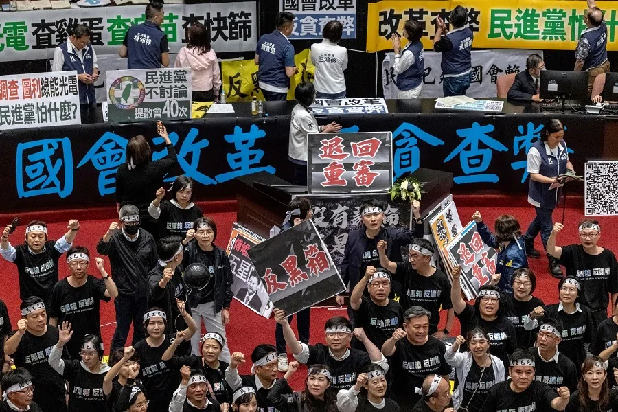 Democratic Progressive Party (DPP) lawmakers protest at the Legislative Yuan in Taipei, Taiwan, on 24 May 2024.  (Lam Yik Fei/Bloomberg)