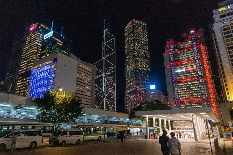 Illuminated office buildings in the Central district in Hong Kong, China, on 20 November 2023. (Paul Yeung/Bloomberg)