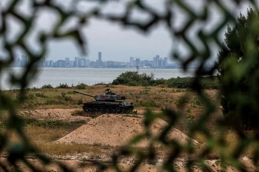 A decommissioned tank is seen outside of the Triangle Fortress in Kinmen as China’s Xiamen city is visible in the background, in Kinmen on 28 October 2025. (I-Hwa Cheng/AFP)