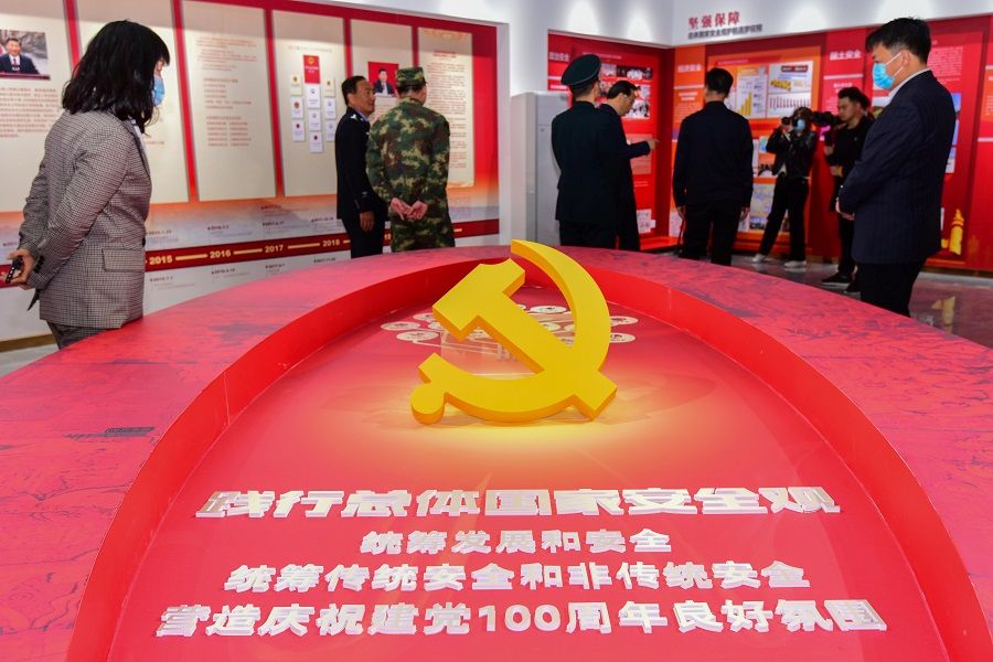Visitors stand near an installation marking the 100th anniversary of the founding of the Communist Party of China, at a newly opened national security education base during the National Security Education Day in Qingzhou, Shandong province, China, 15 April 2021. (CNS photo via Reuters)