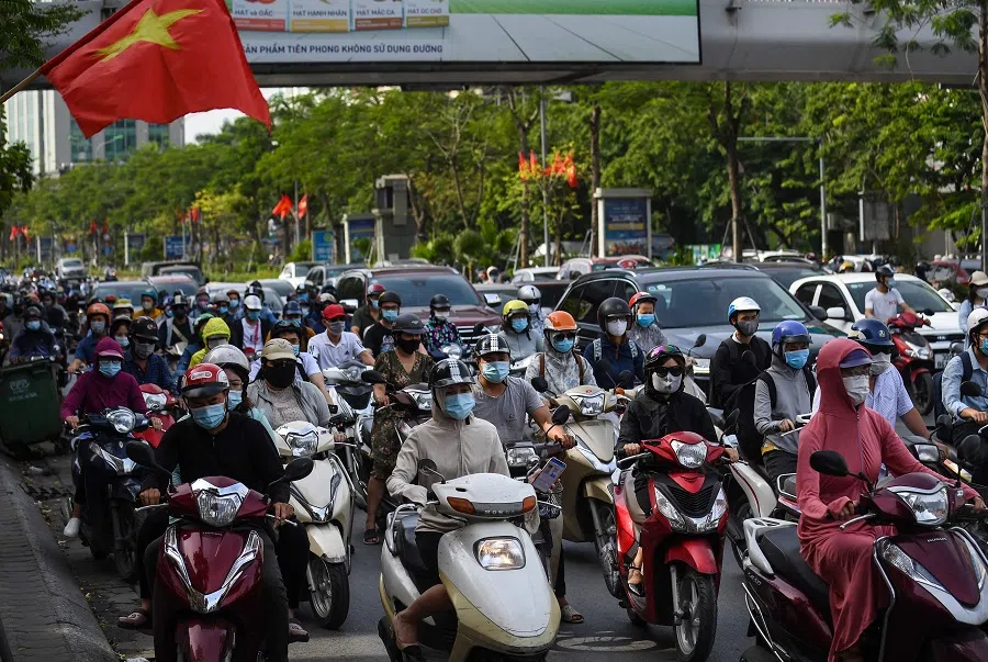 Motorists travel along a road in Hanoi, Vietnam on 2 June 2021. (Nhac Nguyen/AFP)