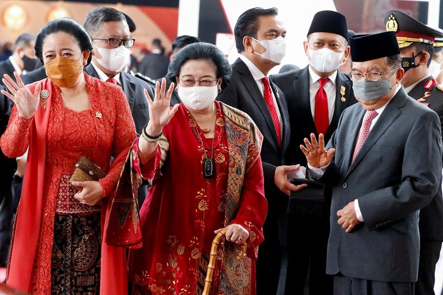 House Speaker Puan Maharani (left), former Indonesian President Megawati Soekarnoputri, and former Vice President Jusuf Kalla wave as they leave the parliament building after Indonesia's President Joko Widodo delivered the annual State of the Nation Address ahead of Indonesia's Independence Day, in Jakarta, Indonesia, 16 August 2022. (Ajeng Dinar Ulfiana/Reuters)