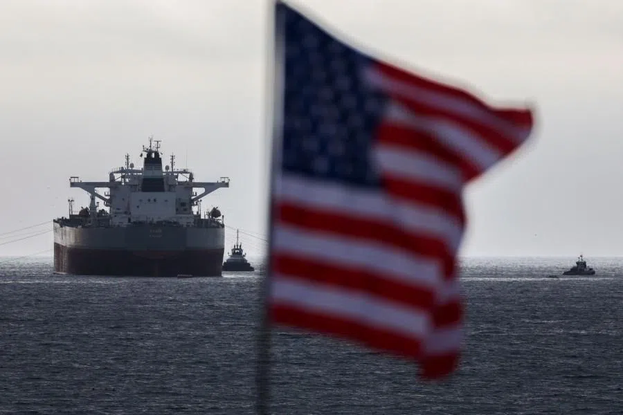 A US flag flutters in the wind as the CHIOS crude oil tanker sits anchored off the coast of the Chevron’s El Segundo Refinery in El Segundo, California, on 4 March 2026. (Patrick T. Fallon/AFP)