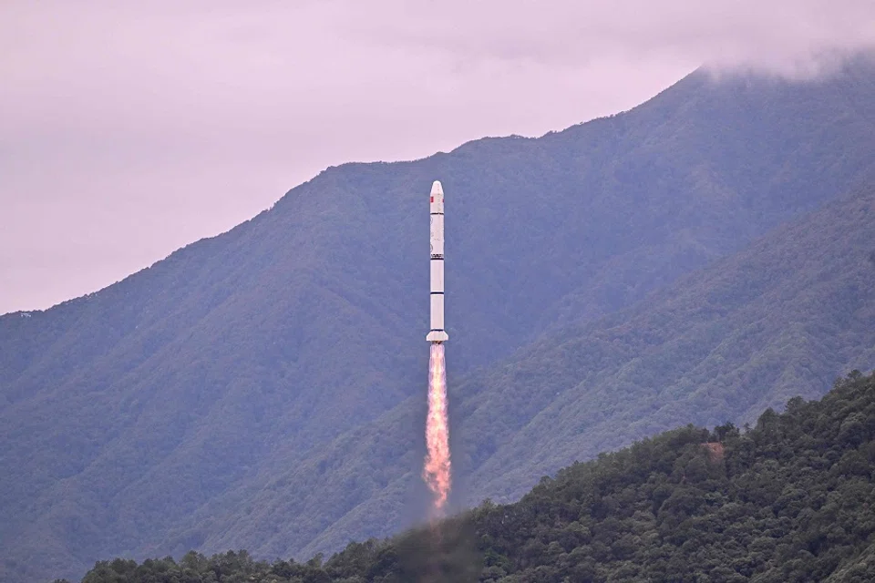 TOPSHOT - A Long March 2-C rocket carrying a satellite jointly developed by China and France dubbed the Space Variable Objects Monitor (SVOM), lifts off from a space base in Xichang, in China’s southwestern Sichuan province, on 22 June 2024.  (Adek Berry/AFP)