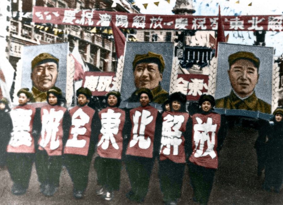 November 1948: The PLA captured Shenyang, and with it the whole of northeast China. At the victory parade, they held up large slogans and giant portraits of Mao Zedong (centre), Zhu De (left), and Lin Biao (right).