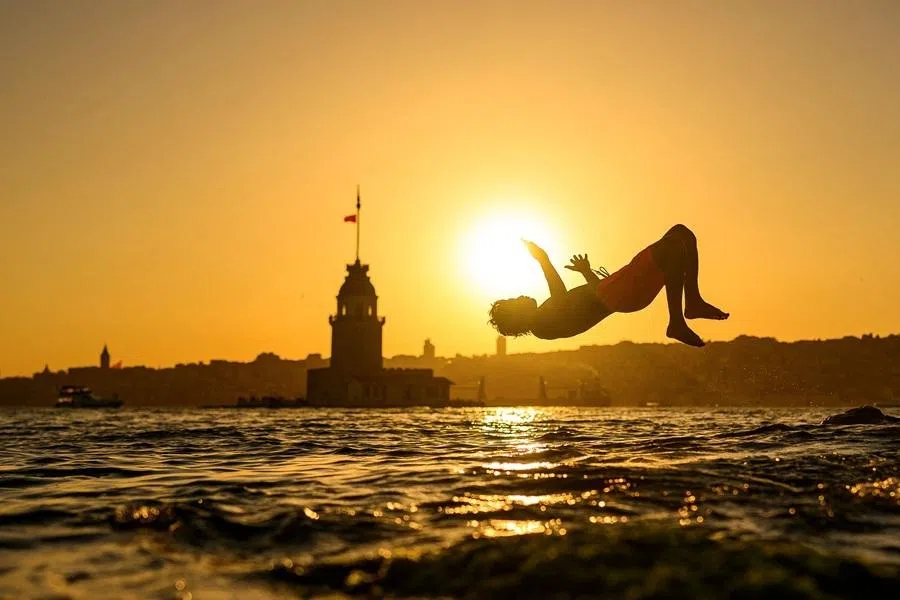 A child jumps into the sea in front of the Maiden’s Tower in Istanbul on 28 June 2026.