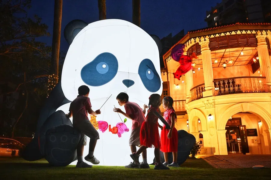Children playing among two giant panda lanterns at the Sun Yat Sen Nanyang Memorial Hall, Singapore, in celebration of the Mid-Autumn Festival, on 28 August 2023. (SPH Media)