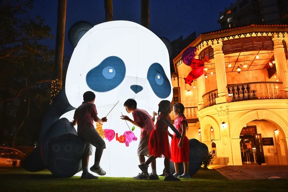 Children playing among two giant panda lanterns at the Sun Yat Sen Nanyang Memorial Hall, Singapore, in celebration of the Mid-Autumn Festival, on 28 August 2023. (SPH Media)