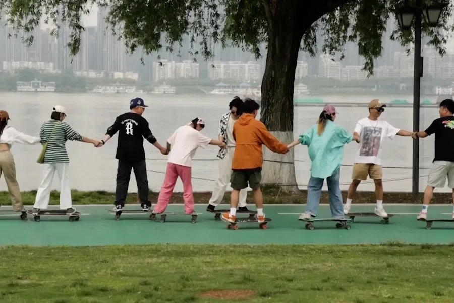 Youths skateboard at a park in Wuhan, Hebei Province. (Screen grab from CCTV)