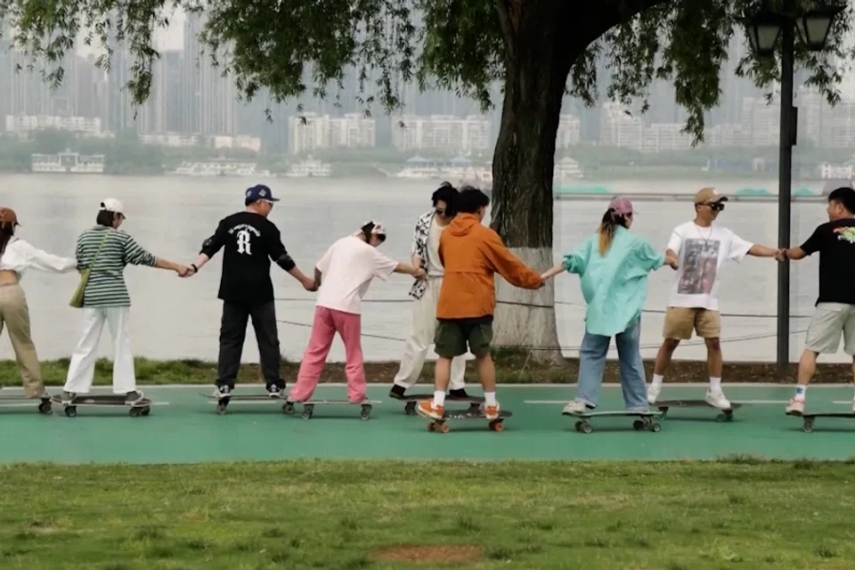 Youths skateboard at a park in Wuhan, Hebei Province. (Screen grab from CCTV)