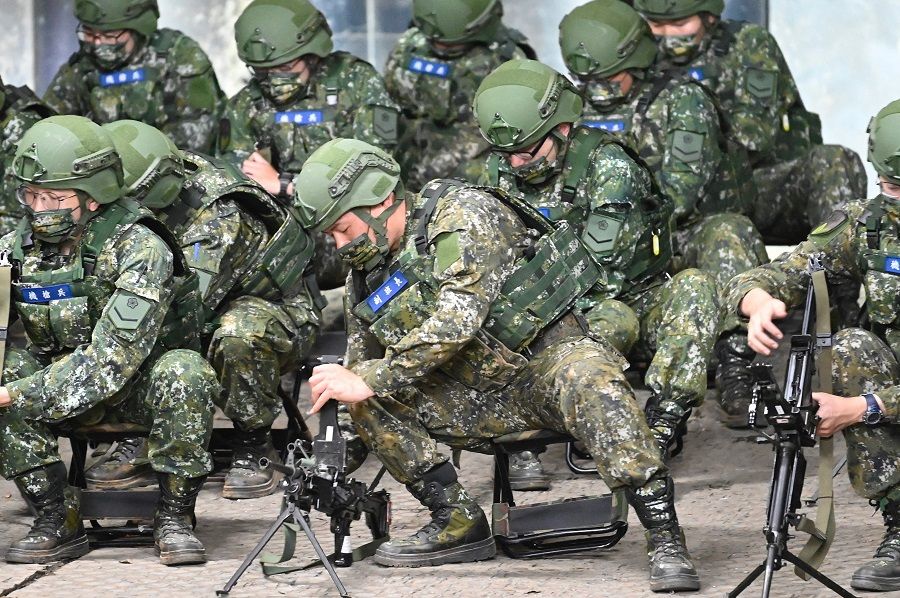 Taiwan's reservists take part in military training at a military base in Taoyuan, Taiwan, on 12 March 2022. (Sam Yeh/AFP)