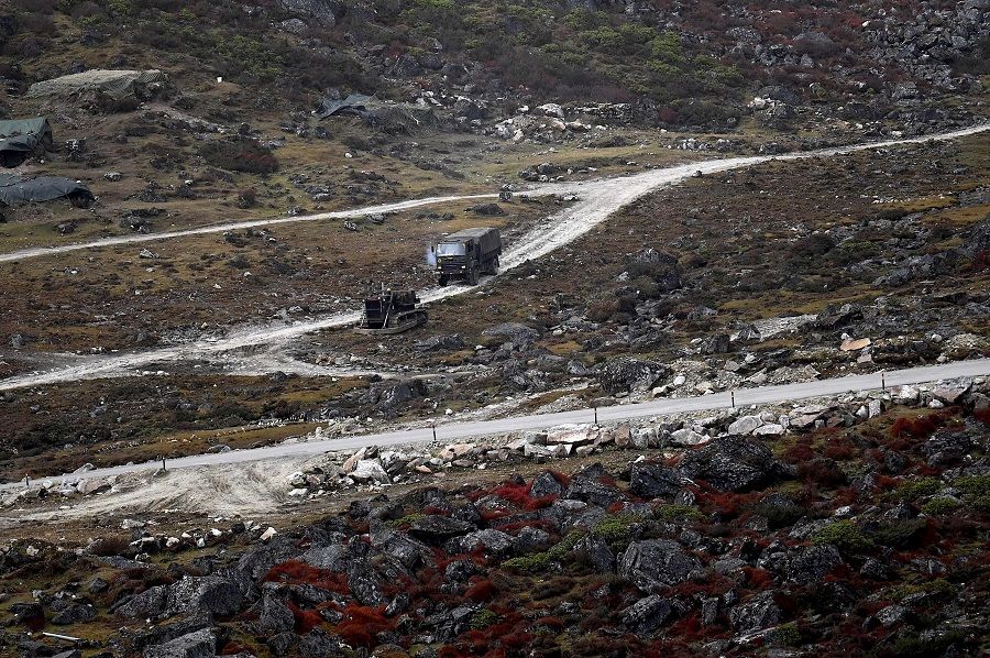 An Indian Army truck drives along a road to Tawang, near the Line of Actual Control (LAC), neighbouring China, near Sela Pass in India's Arunachal Pradesh state, on 21 October 2021. (Money Sharma/AFP)