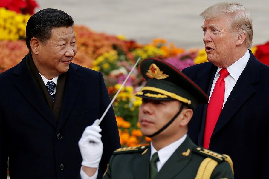 US President Donald Trump (right) takes part in a welcoming ceremony with Chinese President Xi Jinping at the Great Hall of the People in Beijing, China, 9 November 2017. (Damir Sagolj/File Photo/Reuters)