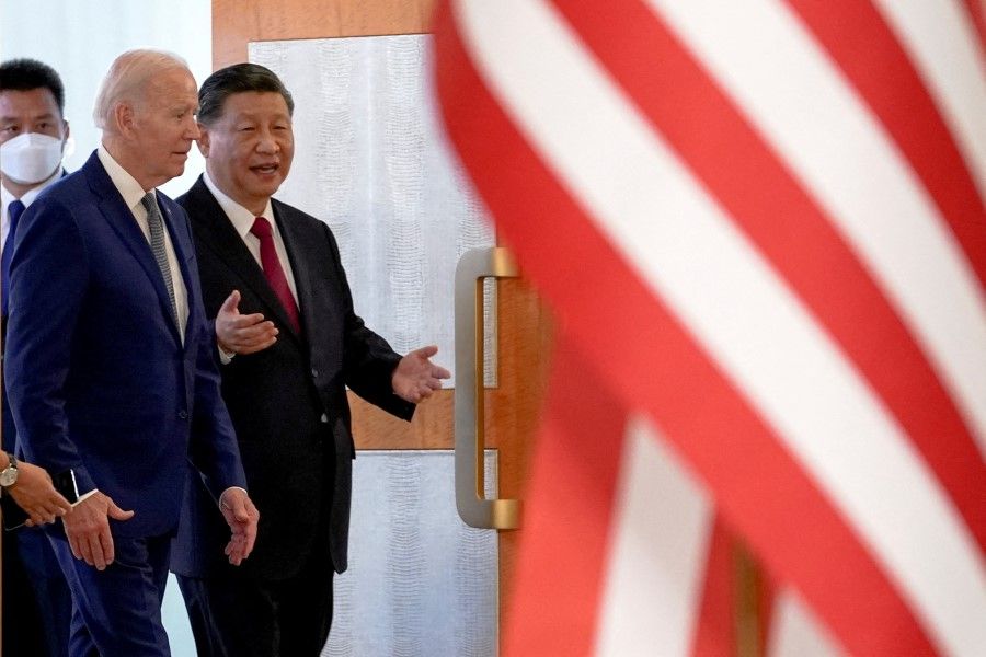 US President Joe Biden (left) meets with Chinese President Xi Jinping (right) on the sidelines of the G20 leaders' summit in Bali, Indonesia, 14 November 2022. (Kevin Lamarque/Reuters)