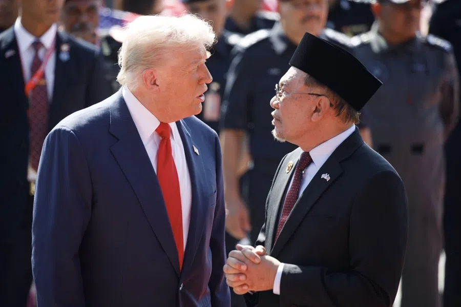 US President Donald Trump, left, speaks with Anwar Ibrahim, Malaysia's prime minister, after arriving at Kuala Lumpur International Airport in Sepang, Selangor, Malaysia, on 26 October 2025. (Samsul Said/Bloomberg)