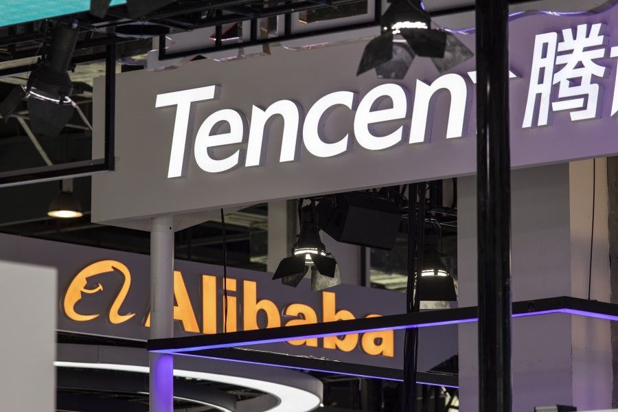 Signage for Tencent Holdings Ltd. and Alibaba Group Holding Ltd. at the World Artificial Intelligence Conference in Shanghai, China, on 8 July 2023. (Qilai Shen/Bloomberg)