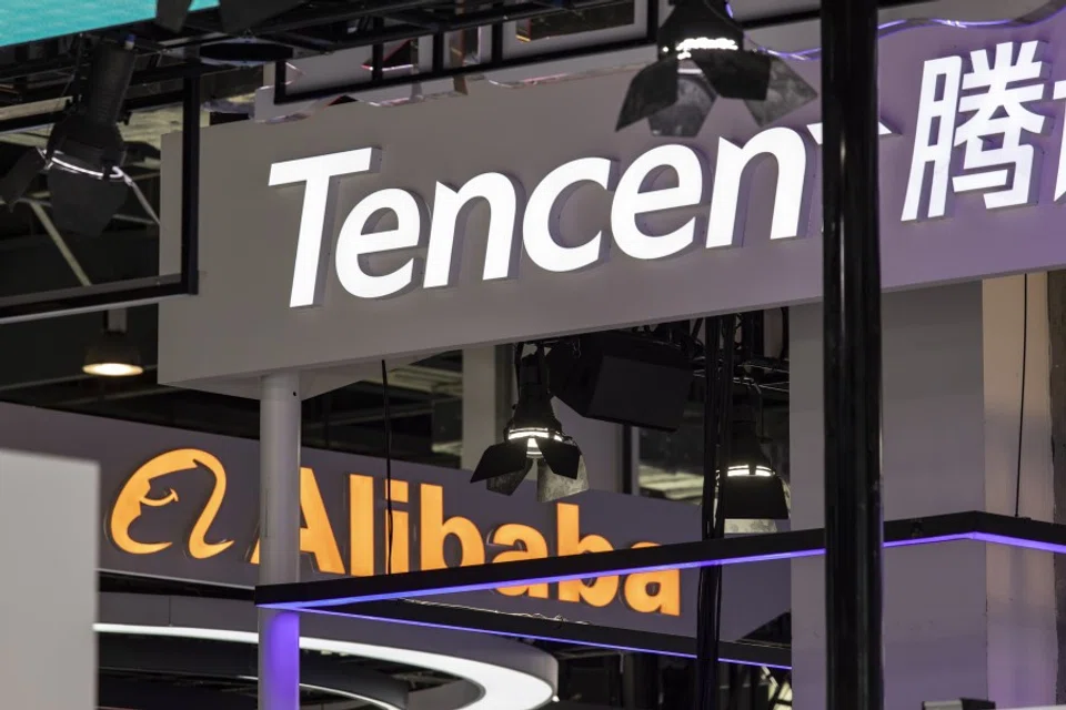 Signage for Tencent Holdings Ltd. and Alibaba Group Holding Ltd. at the World Artificial Intelligence Conference in Shanghai, China, on 8 July 2023. (Qilai Shen/Bloomberg)