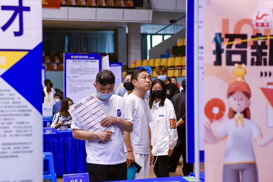 People attend a job fair in Huai'an, in China's eastern Jiangsu province on 26 May 2023. (AFP)