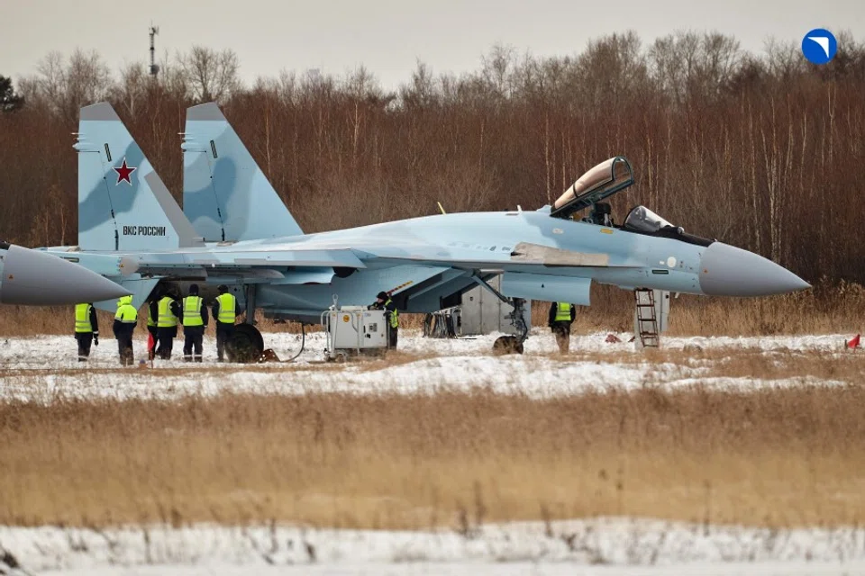 This handout picture provided by the Russian defence corporation Rostec on 24 November 2023 shows a Sukhoi Su-35S fighter jet at the grounds of an aviation firm in the far eastern city of Komsomolsk-on-Amur. (Handout/Russian defence corporation Rostec/AFP)
