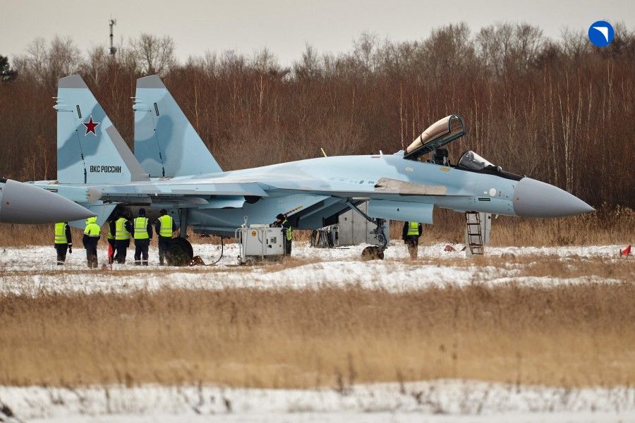 This handout picture provided by the Russian defence corporation Rostec on 24 November 2023 shows a Sukhoi Su-35S fighter jet at the grounds of an aviation firm in the far eastern city of Komsomolsk-on-Amur. (Handout/Russian defence corporation Rostec/AFP)