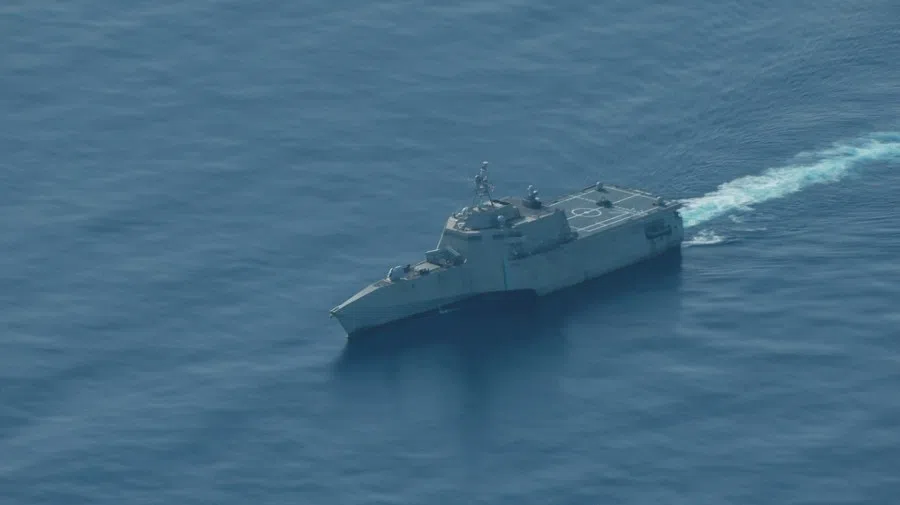 An aerial view of the USS Cincinnati combat ship navigating near the disputed Scarborough Shoal, as a Philippine Coast Guard aircraft carrying journalists patrols the area, days after two Chinese vessels collided in the area while allegedly trying to block a Philippine supply mission, in the South China Sea, on 13 August 2025. (Adrian Portugal/Reuters)