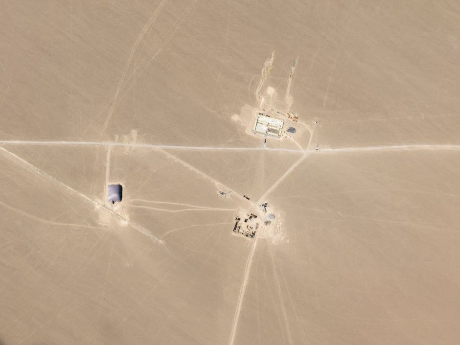 This undated handout satellite image obtained on 29 July 2021 courtesy of Planet Labs Inc. shows an image that researchers say are missile silos under construction in the Chinese desert. (Handout/Planet Labs, Inc./AFP)