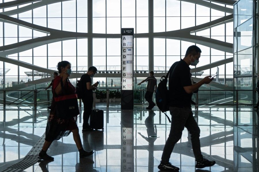 Travellers walk through Beijing Daxing International Airport in Beijing, China, on 25 August 2020. (Yan Cong/Bloomberg)