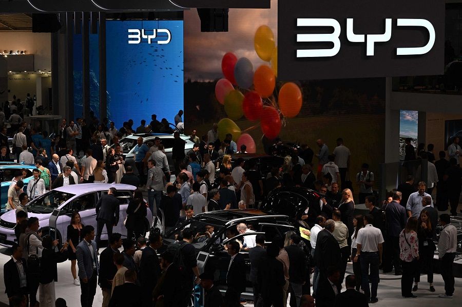 People visit the booth of Chinese car maker BYD at the International Motor Show in Munich, southern Germany, on 5 September 2023. China's top electric automaker BYD will build a car factory in Hungary, the company said on 22 December 2023, as it eyes expansion in the European market. (Christof Stache/AFP)