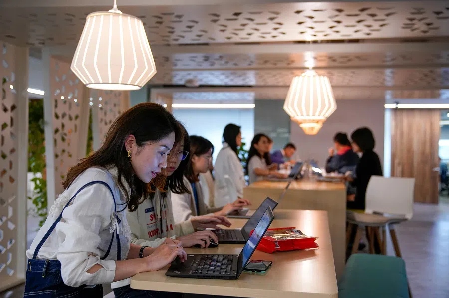 Employees work at an office at the headquarters of Ant Group, an affiliate of Alibaba, in Hangzhou, Zhejiang province, China, 29 October 2020. (Aly Song/Reuters)