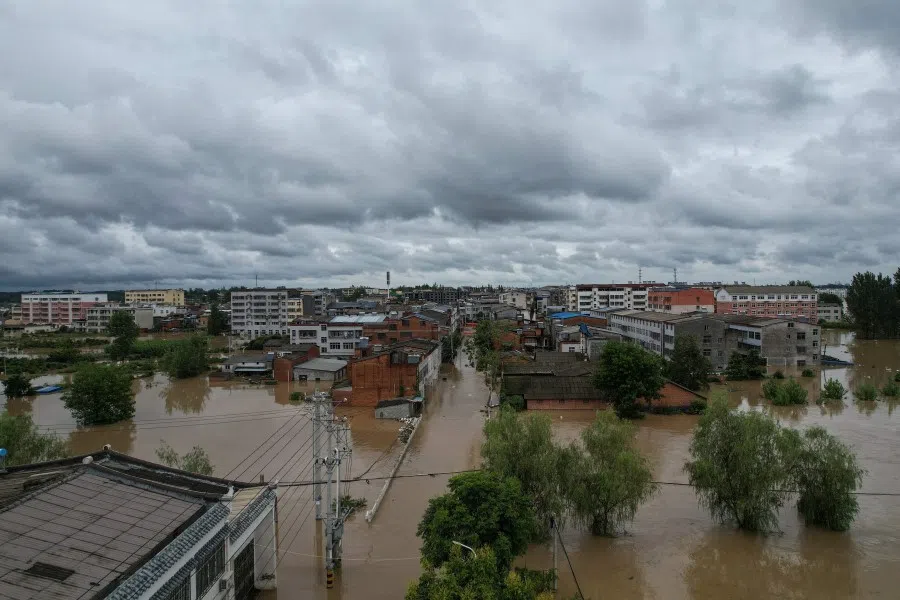 This overhead view taken on 12 August 2021 shows flooded streets following heavy rains in Suizhou in China's central Hubei province. (STR/CNS/AFP)