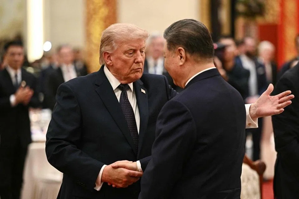 China's President Xi Jinping (right) and US President Donald Trump shake hands as they attend a state banquet at the Great Hall of the People in Beijing on 14 May 2026. (AFP)