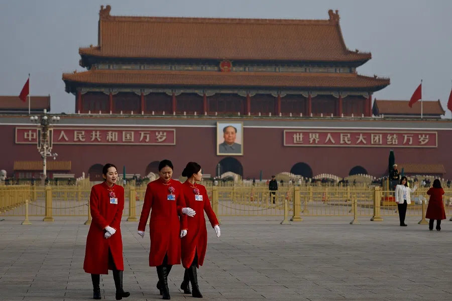 Attendants walk past Tiananmen Square, on the day of the closing session of the Chinese People’s Political Consultative Conference at the Great Hall of the People in Beijing, China, on 10 March 2025. (Tingshu Wang/Reuters)