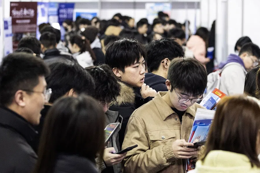 University students attend a job fair in Wuhan, Hubei province, China, on 6 March 2024. (AFP)