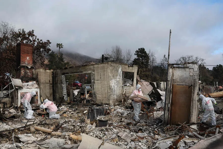 Volunteers amid rubble following the Eaton Fire, on 5 February 2025 in Altadena, California. (Mario Tama/Getty Images via AFP)