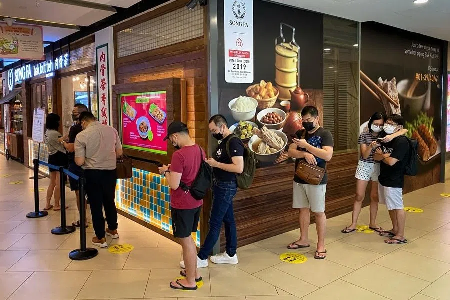 Customers queueing at Song Fa Bak Kut Teh in Seletar Mall, Singapore, on 12 January 2022.