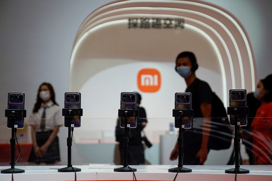 A view of mobile phones in front of the Xiaomi logo at the China Digital Entertainment Expo and Conference, also known as ChinaJoy, in Shanghai, China, 30 July 2021. (Aly Song/File Photo/Reuters)