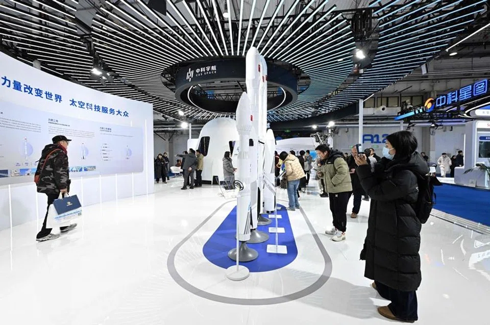 People visit the 2026 Beijing International Commercial Space Exhibition in Beijing on 23 January 2026. (Adek Berry/AFP)