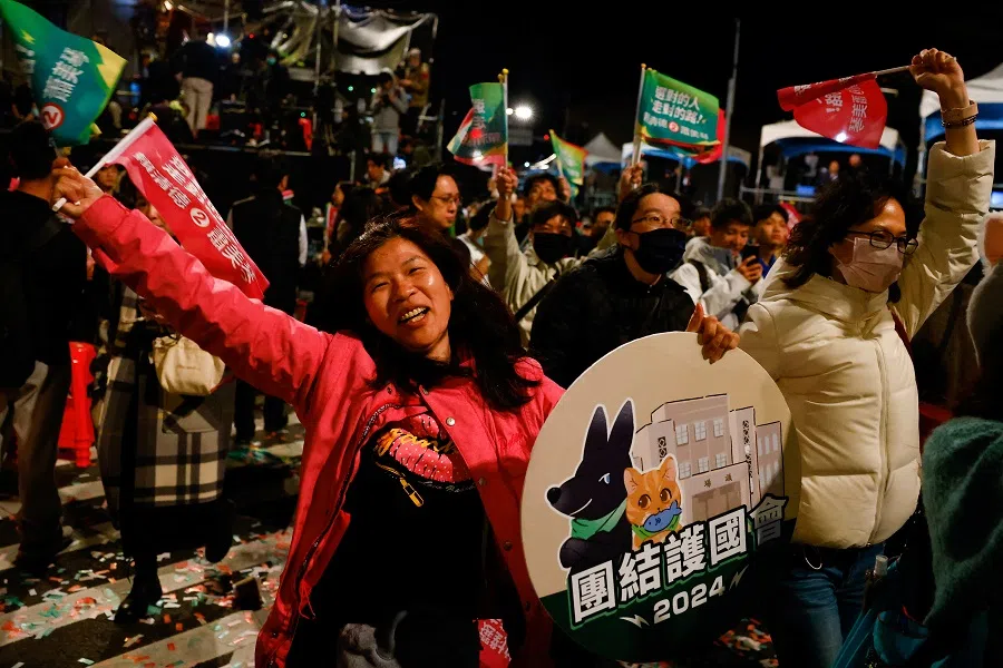 Supporters of the Democratic Progressive Party (DPP) celebrate during a rally, following the victory of Lai Ching-te in the presidential elections, in Taipei, Taiwan, on 13 January 2024. (Ann Wang/Reuters)
