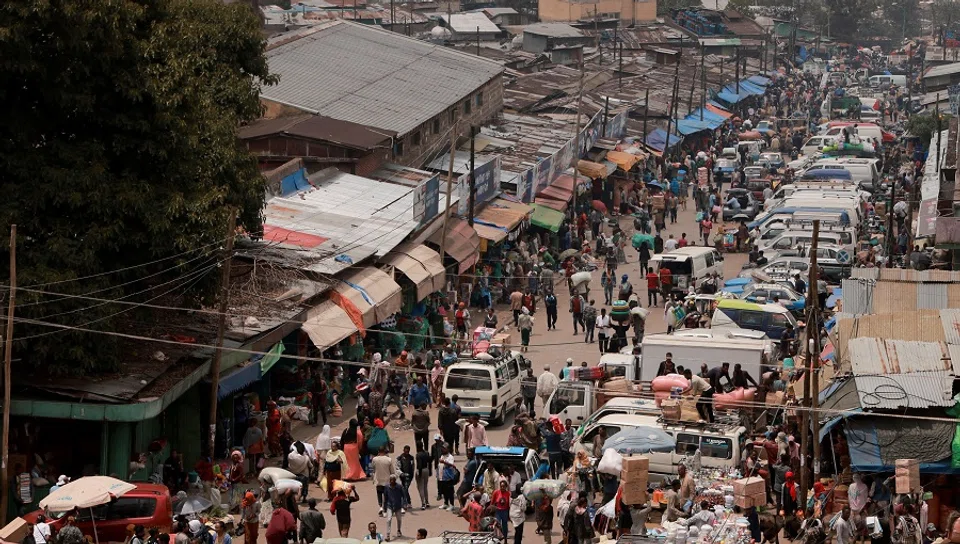 Shoppers walk within Merkato, one of Africa’s biggest open air market, in Addis Ababa, Ethiopia, on 25 April 2024. (Tiksa Negeri/Reuters)