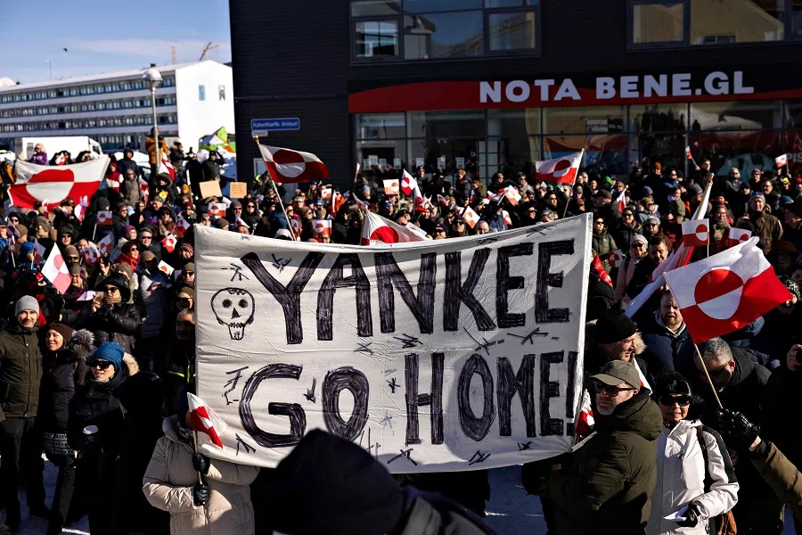 Protesters hold a banner reading “Yankee Go Home” during a march to the US consulate during a demonstration, under the slogan “Greenland belongs to the Greenlandic people”, in Nuuk, Greenland, on 15 March 2025. (Christian Klindt Soelbeck/AFP)