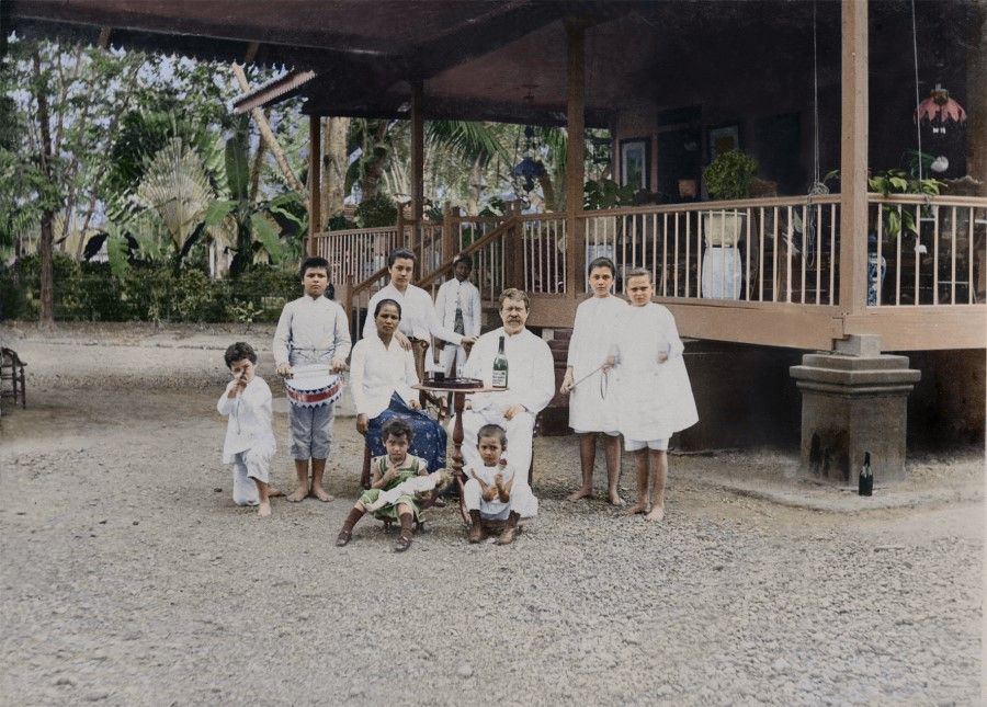 A valuable image of early Singapore showing a Eurasian family, with a Caucasian man who married a local Malay woman. Their children show both Western and Malay characteristics as early Eurasians, one of the minority groups in Singapore. While they do not live in a Western house made of bricks, their living conditions are definitely better than most local Malays. The children are barefoot, but there are servants in the house, which is rare for locals.