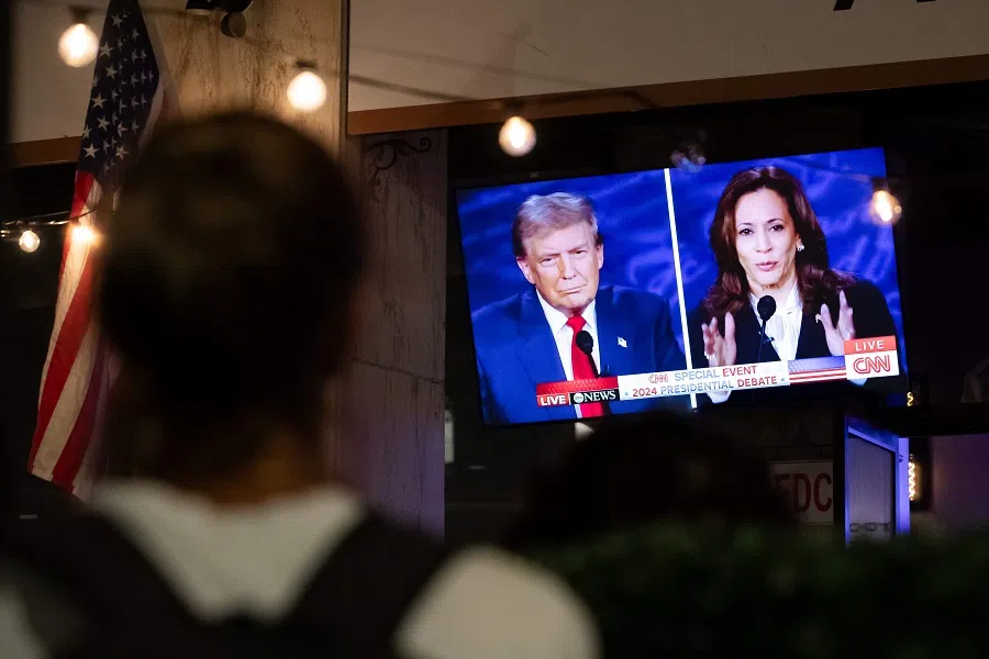 A screen displaying the US Presidential debate between Vice President and Democratic presidential candidate Kamala Harris and former US President and Republican presidential candidate Donald Trump at The Admiral in Washington, DC on 10 September 2024. (Allison Bailey/AFP)
