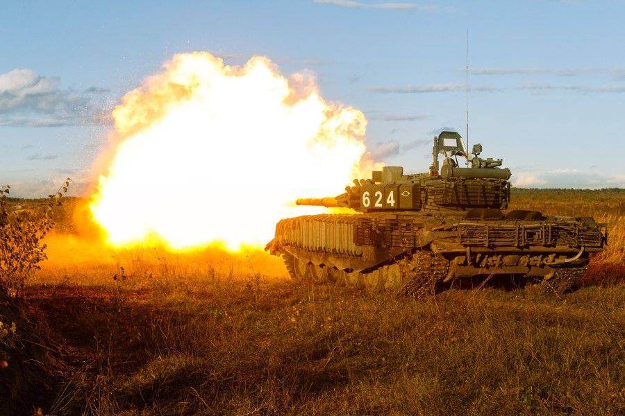 A tank fires during the active phase of the military exercises "Zapad-2021" staged by the armed forces of Russia and Belarus at the Mulino training ground in Nizhny Novgorod Region, Russia, 10 September 2021. The drills also involve military personnel from Armenia, India, Kazakhstan, Kyrgyzstan and Mongolia. (Vadim Savitskiy/Russian Defence Ministry Press Service/Handout via Reuters)