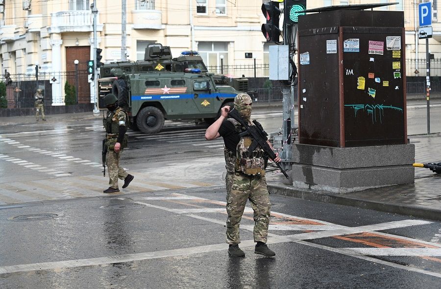 Fighters of Wagner private mercenary group are deployed in a street near the headquarters of the Southern Military District in the city of Rostov-on-Don, Russia, 24 June 2023. (Stringer/Reuters)