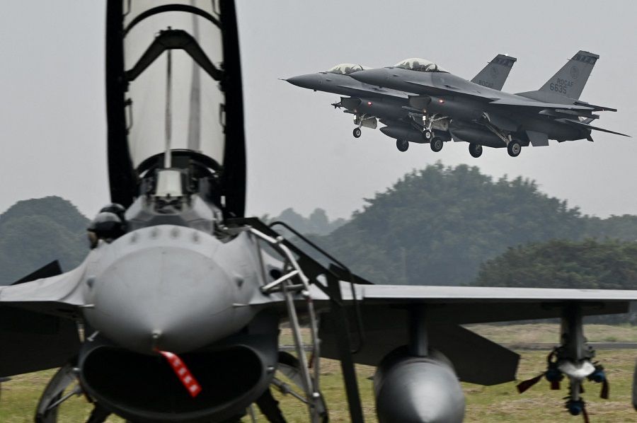 Two armed US-made F-16V fighters fly over at an air force base in Chiayi, Taiwan on 5 January 2022. (Sam Yeh/AFP)